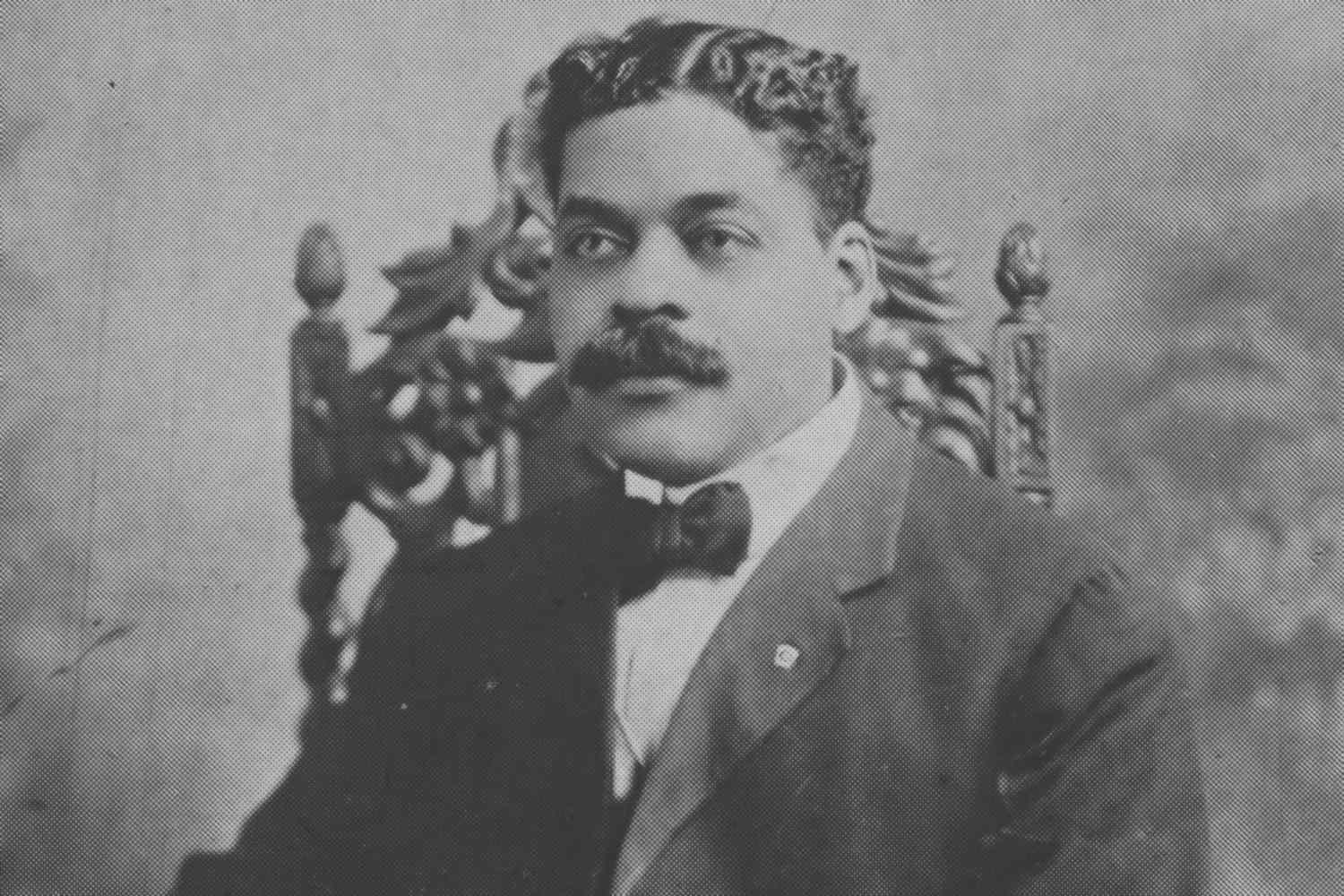 Arturo Alfonso Schomburg sitting for a portrait taken by an unknown photographer at an unknown date.