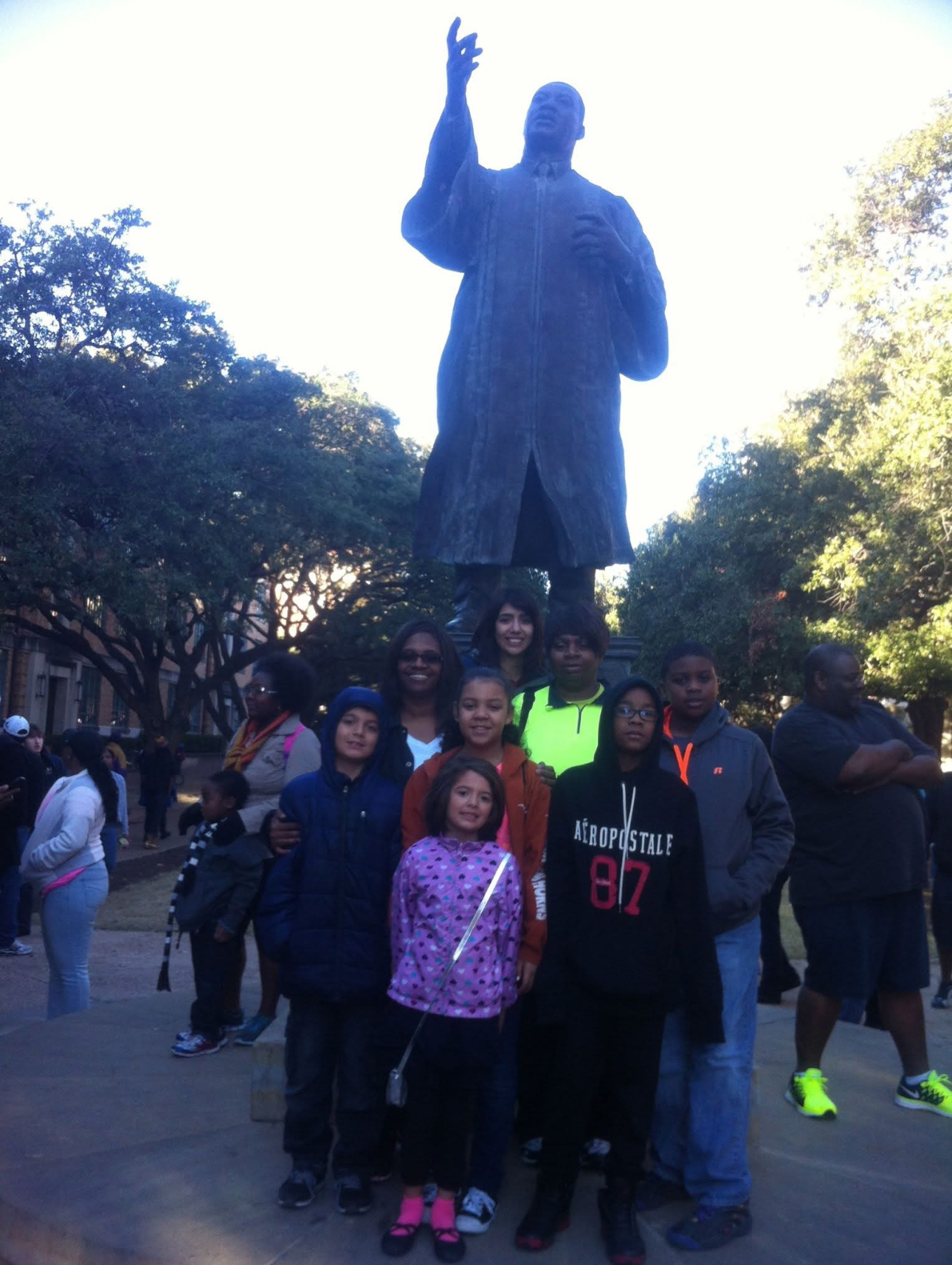 Family infront of statue of Martin Luther King Jr.