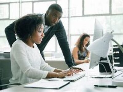 Two people on a computer